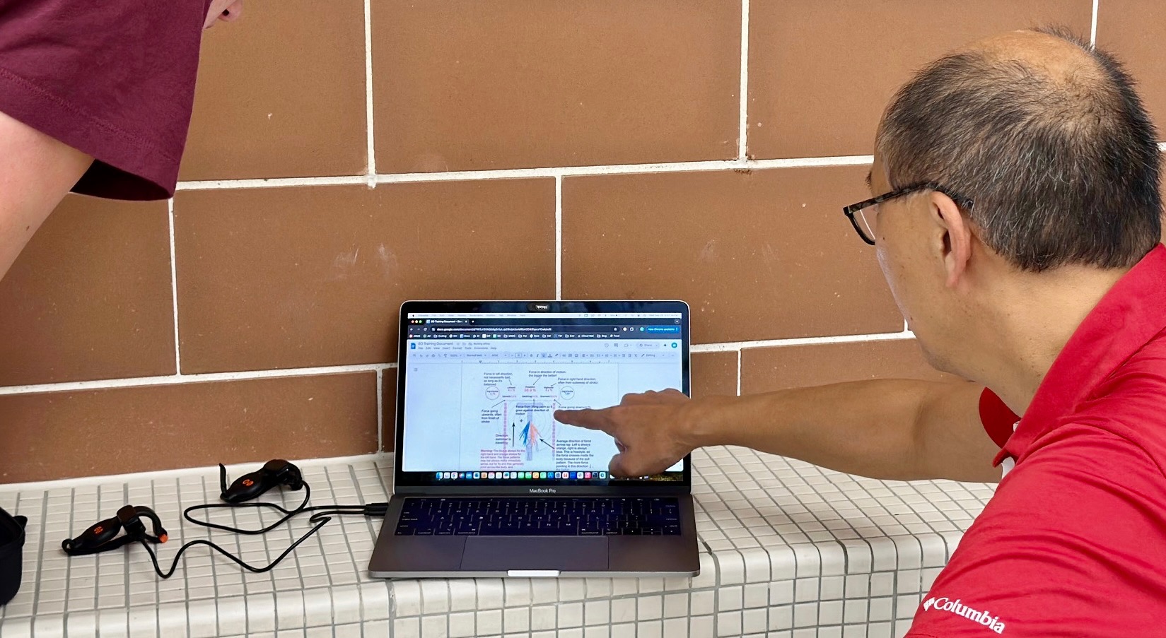 Dr. Ken Ono analyzing swim data